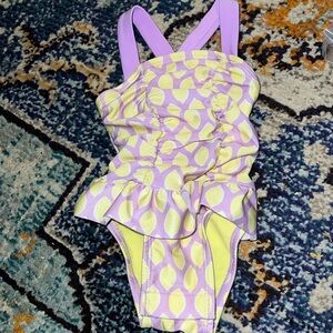 Orchid one piece bathing suit in gorgeous orchid w/ lemon graphic. Cat & Jack.